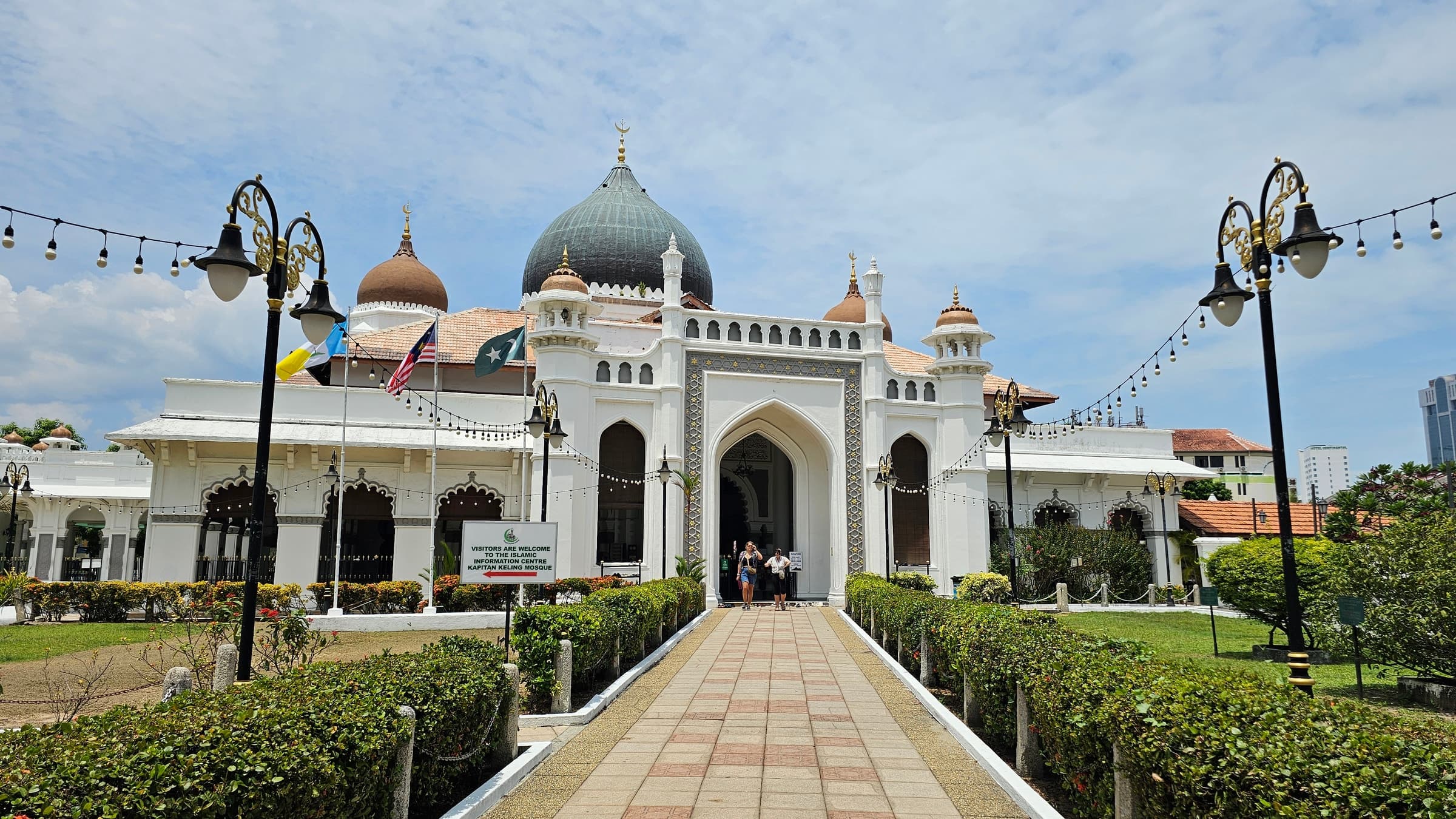 The white domes and minaret of the Kapitan Keling Mosque in George Town, Penang