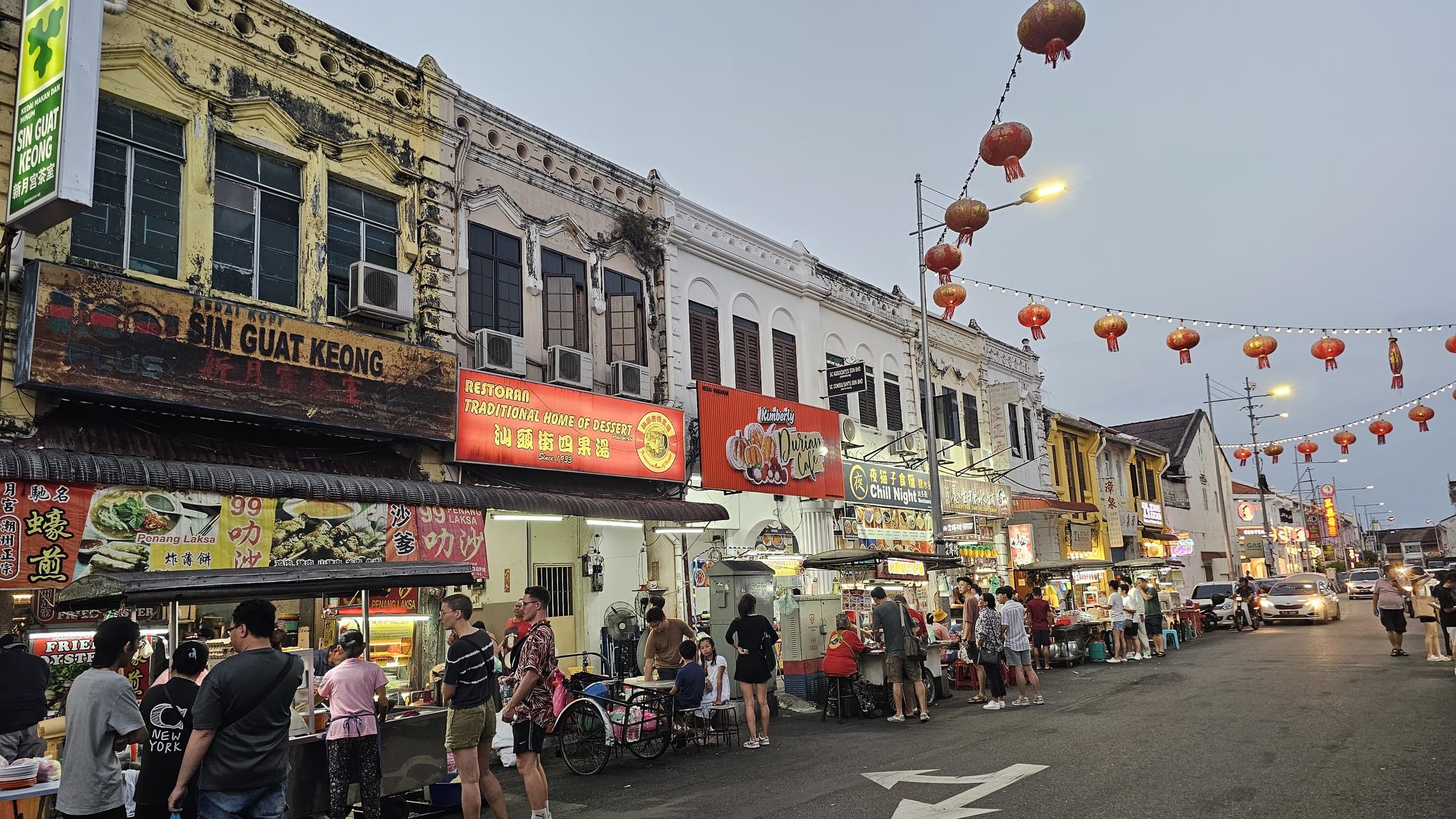 Hawker stalls lining a Chinatown street in George Town at night