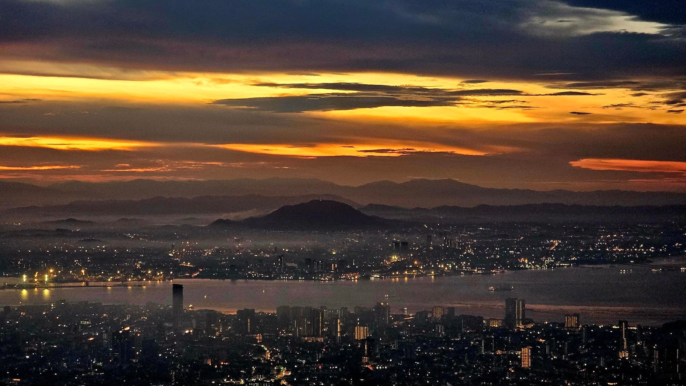 Sunrise view over George Town and the Strait of Malacca from the top of Penang Hill