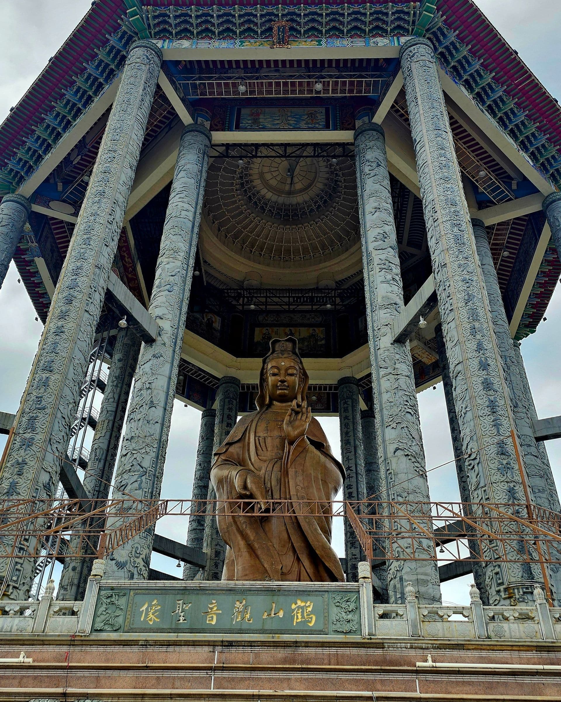 Ornate prayer halls and tiled pavilion roofs stacked up the slope at Kek Lok Si